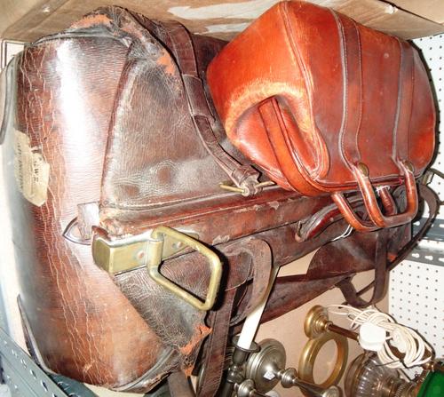 A dark brown leather Gladstone bag and a smaller leather bag.