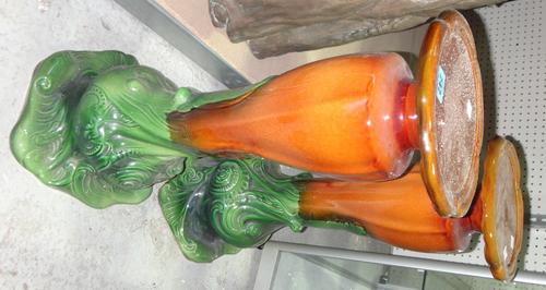 A pair of 20th century green and brown glaze pottery jardiniere stands.