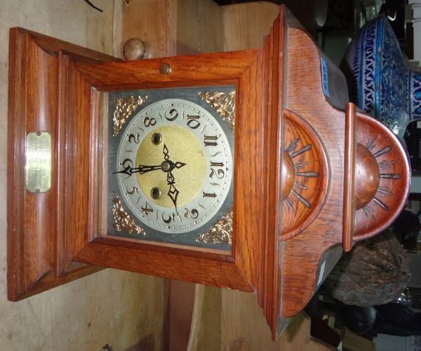 An early 20th century oak mantel clock.