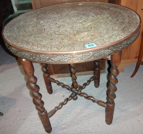 A 20th century brass and wooden circular folding tray table.