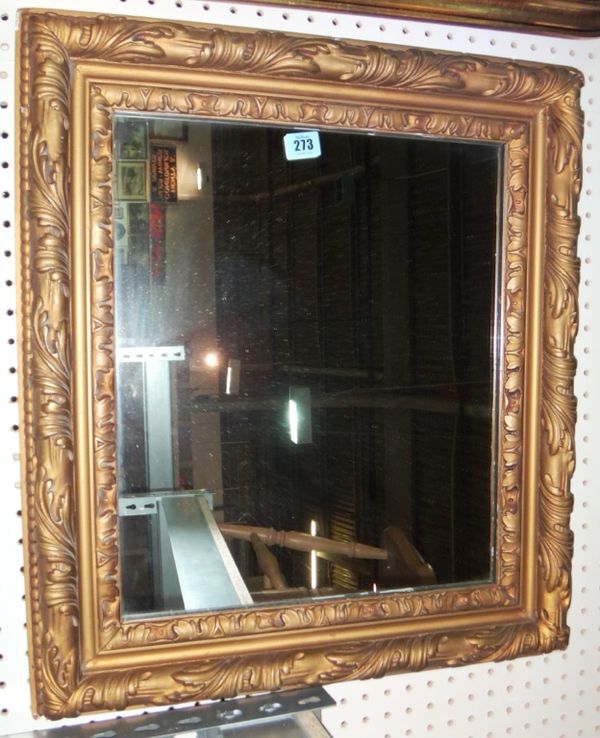 A rectangular gilt framed wall mirror.