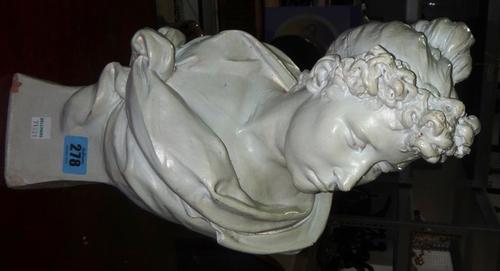 A plaster bust of a female and two bronze cherub wall lights.