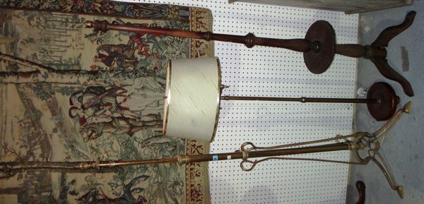 An Art Nouveau brass standard lamp, together with two further standard lamps.
