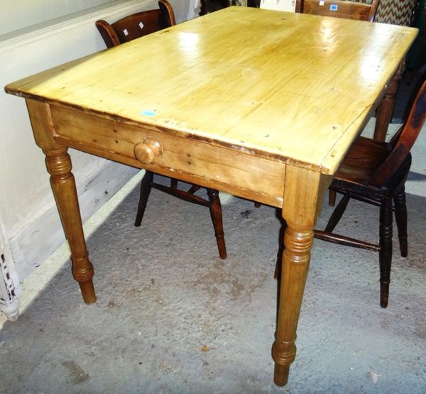 A 19th century pine rectangular dining table.