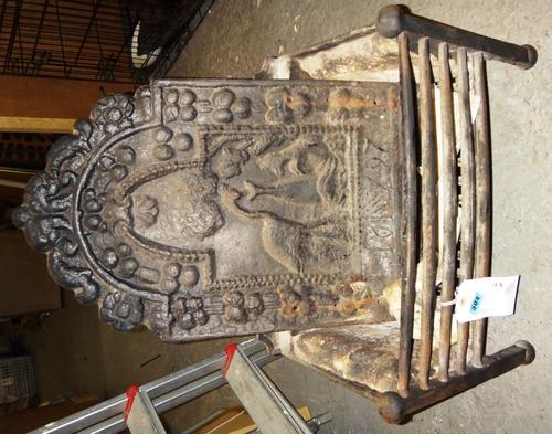 A wrought iron fire basket with integral back.