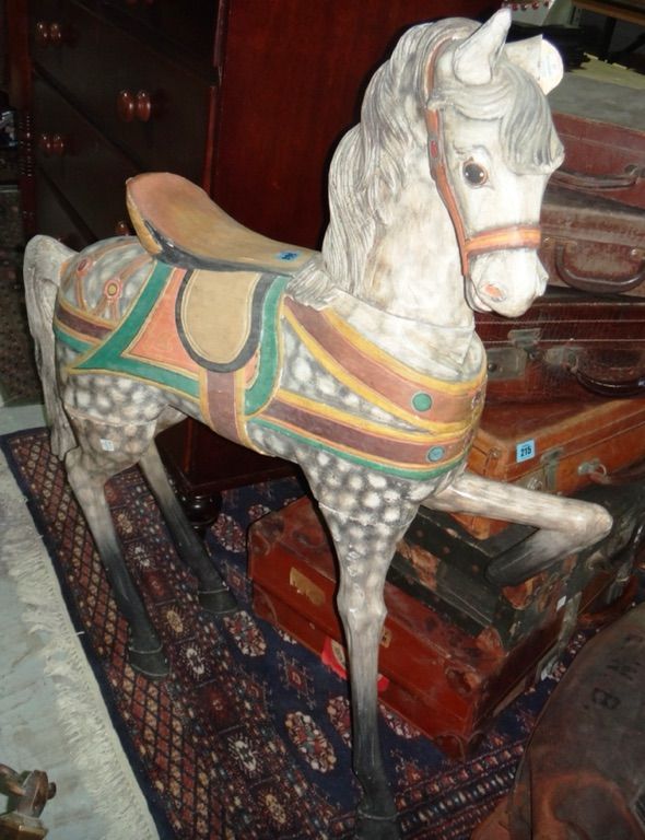 A 20th century wooden model of a horse, with painted decoration.