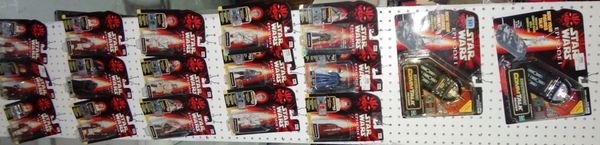 A quantity of small Star Wars figures, boxed.