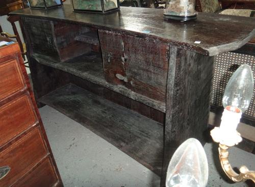 An Arts and Crafts oak sideboard.