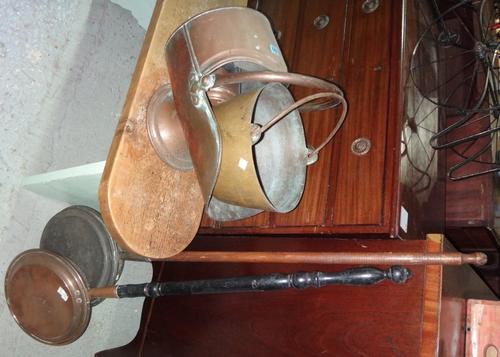 A quantity of copper and brass including coal scuttles, copper warming pans, tole lamp shades and sundry.