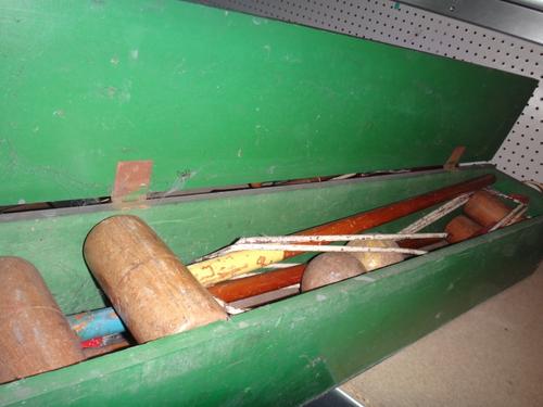 A 20th century croquet set in a green painted box.