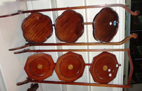 A mahogany folding three tier cake stand and another.