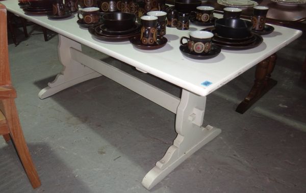 A 20th century white painted rectangular dining table.