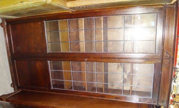 A 20th century oak tall glazed bookcase.