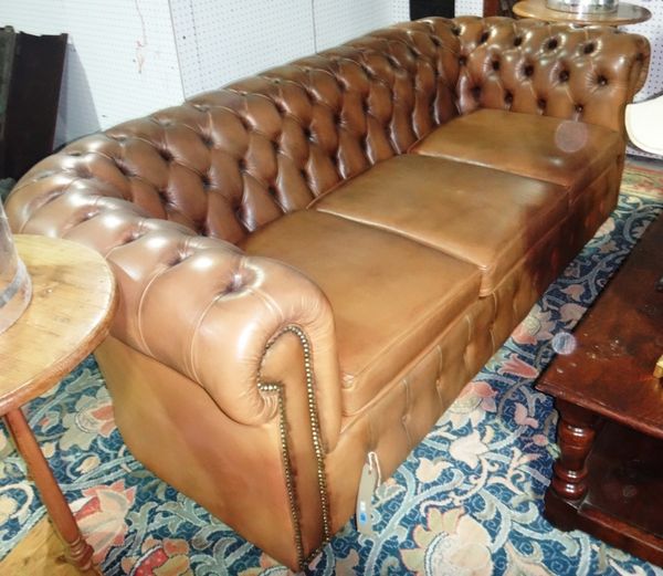 A 20th century brown leatherette Chesterfield sofa.