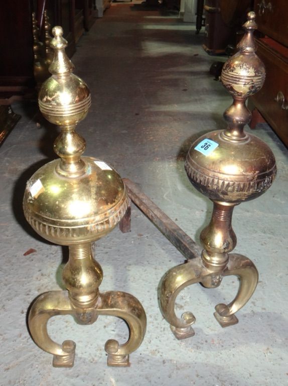 A pair of 19th century brass firedogs.