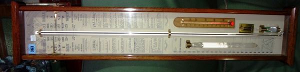 A 20th century oak cased wall barometer.