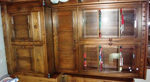 A 20th century Ercol style bookcase with glazed top section.