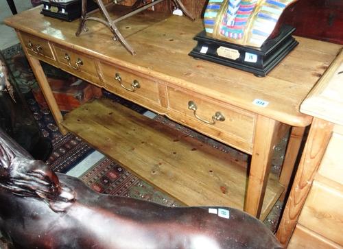 A pine dresser base of 18th century design.