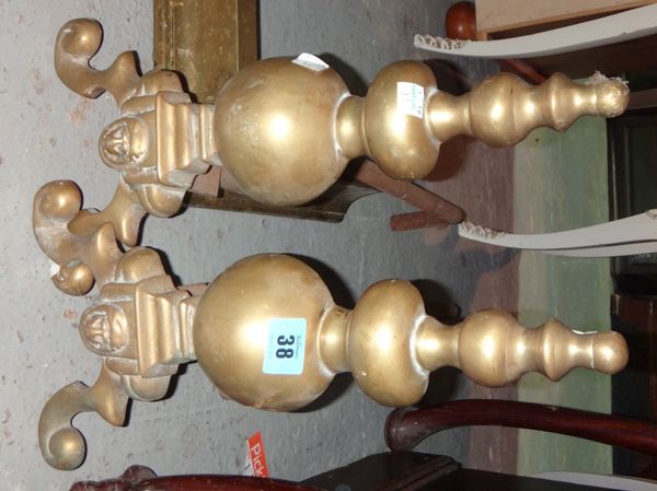 A pair of 20th century brass fire dogs.