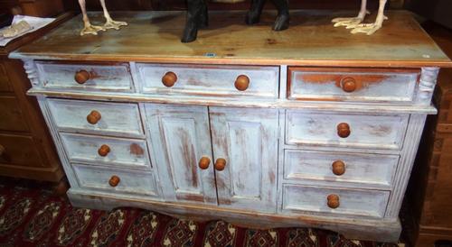 A 20th century painted pine dresser base, with an arrangement of cupboards and drawers.