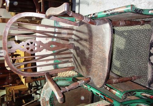 A 19th century ash wheel back armchair, together with a mahogany balloon back single chair.