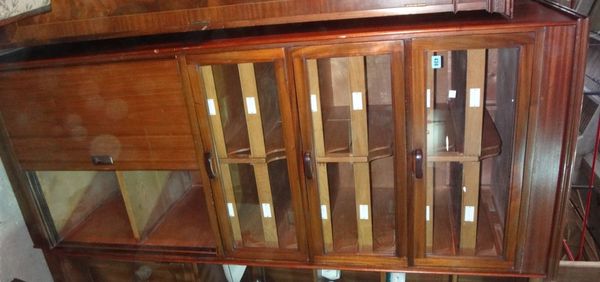 A 20th century mahogany haberdashery cupboard.