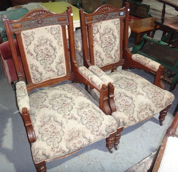 Two oak framed armchairs.