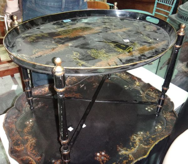 A 20th century chinoiserie decorated oval metal tray on stand.
