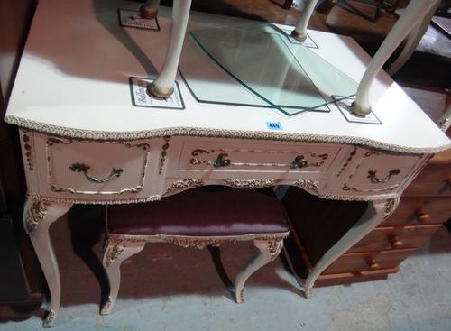 A 20th century gilt and cream painted dressing table and a matching stool,  together with two three drawer bedside chests.