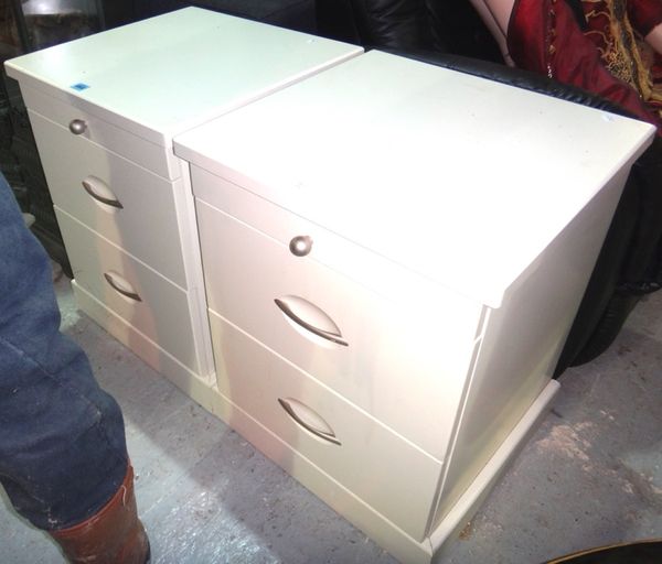 A pair of 20th century white painted bedside tables.