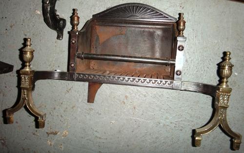 A 19th century steel and brass fire basket.