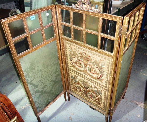 A 19th century gilt framed two fold screen with bevelled glass and upholstered panels, and a Louis XV style gilt oval stool.