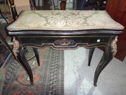 A Louis XV style gilt metal mounted ebonised card table.