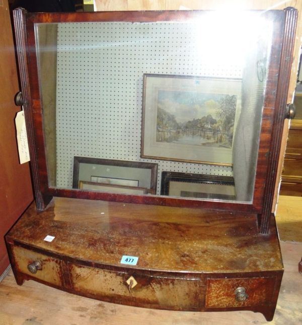 A 19th century mahogany bowfront swing frame mirror.