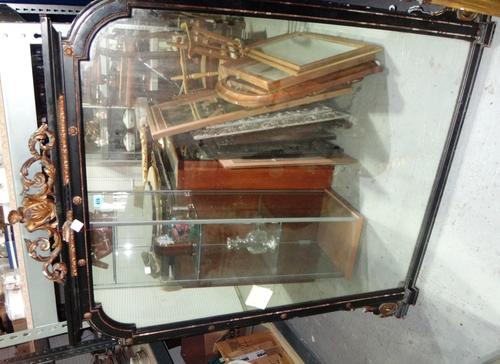 A Victorian ebonised and gilt metal mounted overmantel mirror with gilt bow surmount.