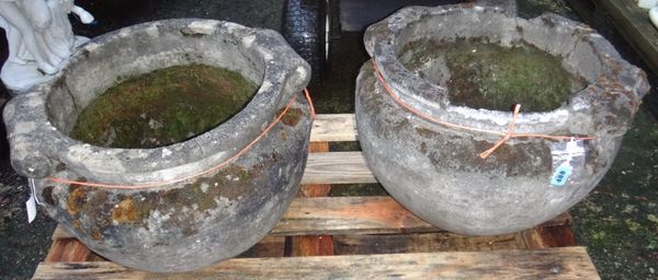 A pair of reconstituted stone twin handled pots of Compton design.