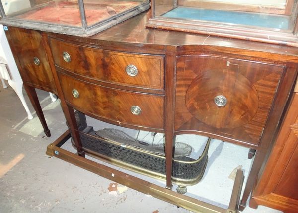 A 20th century mahogany serpentine sideboard, with a pair of drawers flanked by a pair of cupboards.