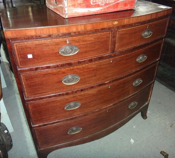 A 19th century mahogany bowfront and chequer strung chest of two short and three long graduated drawers.