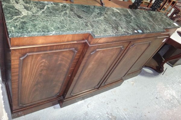A 20th century mahogany breakfront side cabinet with green marble top.