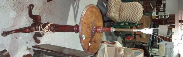 A 19th century mahogany adjustable standard lamp with circular tray and tripod base.