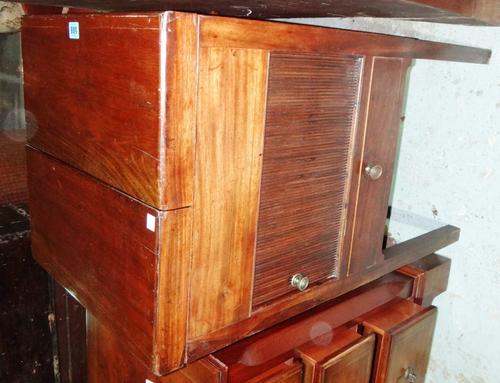 A mahogany tambour framed lift top wash stand.