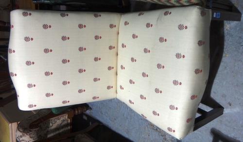 A mahogany high back upholstered chair.