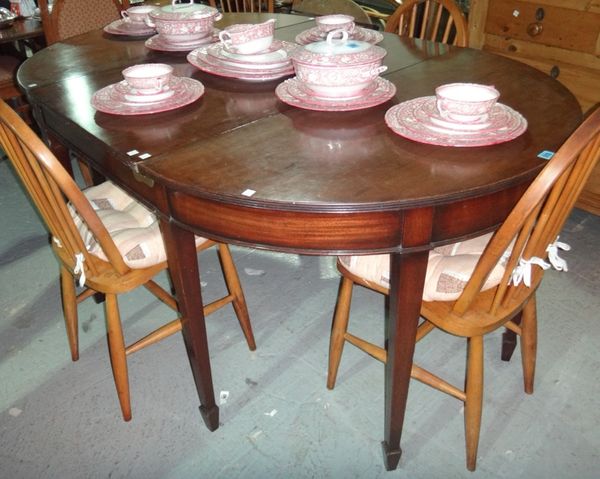 An 18th century style mahogany dining table with a pair of console 'D' end sections and one extra leaf, on tapering square supports, 107cm wide x 167c