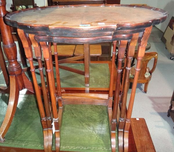A nest of three walnut tables, with pie-crust rims, together with an inlaid walnut octagonal occasional table.