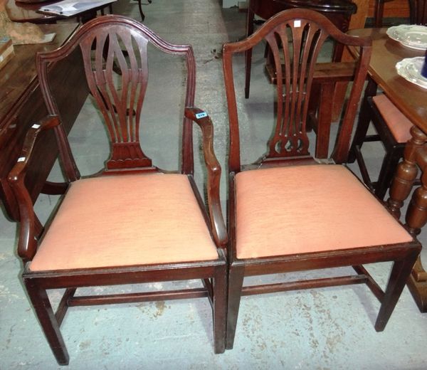 A set of six 19th century mahogany dining chairs with pierced splats on tapering square supports, to include a pair of  associated carvers.