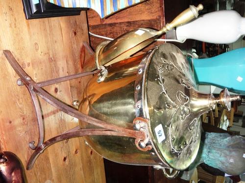 A 19th century brass and steel coal bucket on stand.
