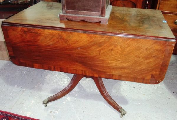 A George III mahogany drop flap centre table.