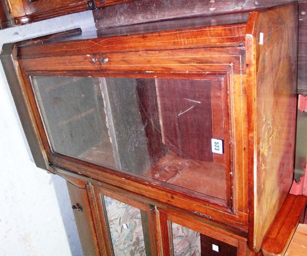 A Victorian walnut inlaid music cabinet with single glazed door.