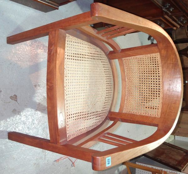 A pair of 20th century hardwood chairs with rattan seats.