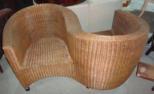 A 20th century wicker conversation chair.